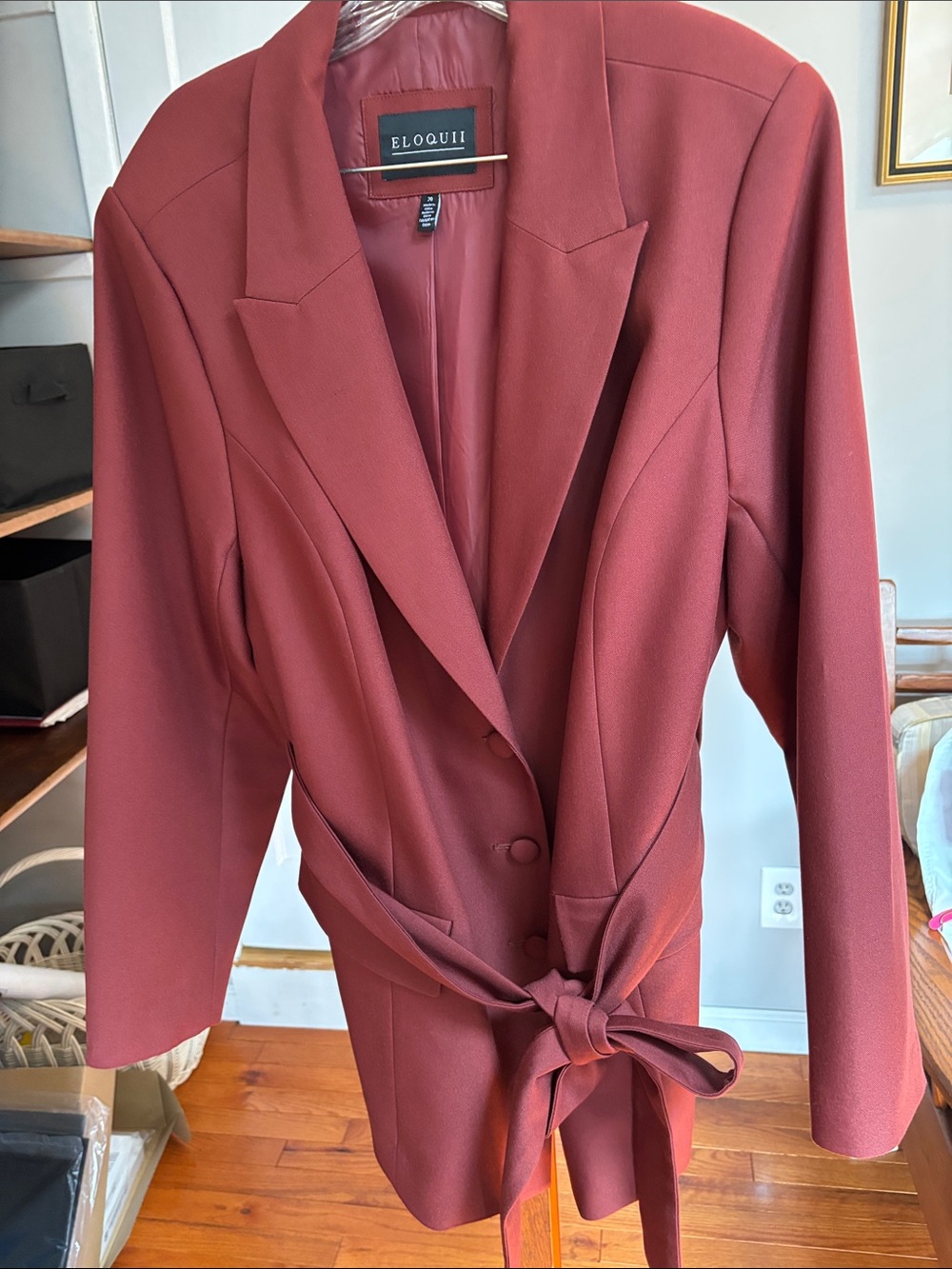 Burgundy women’s long blazer with detached attractive belt.